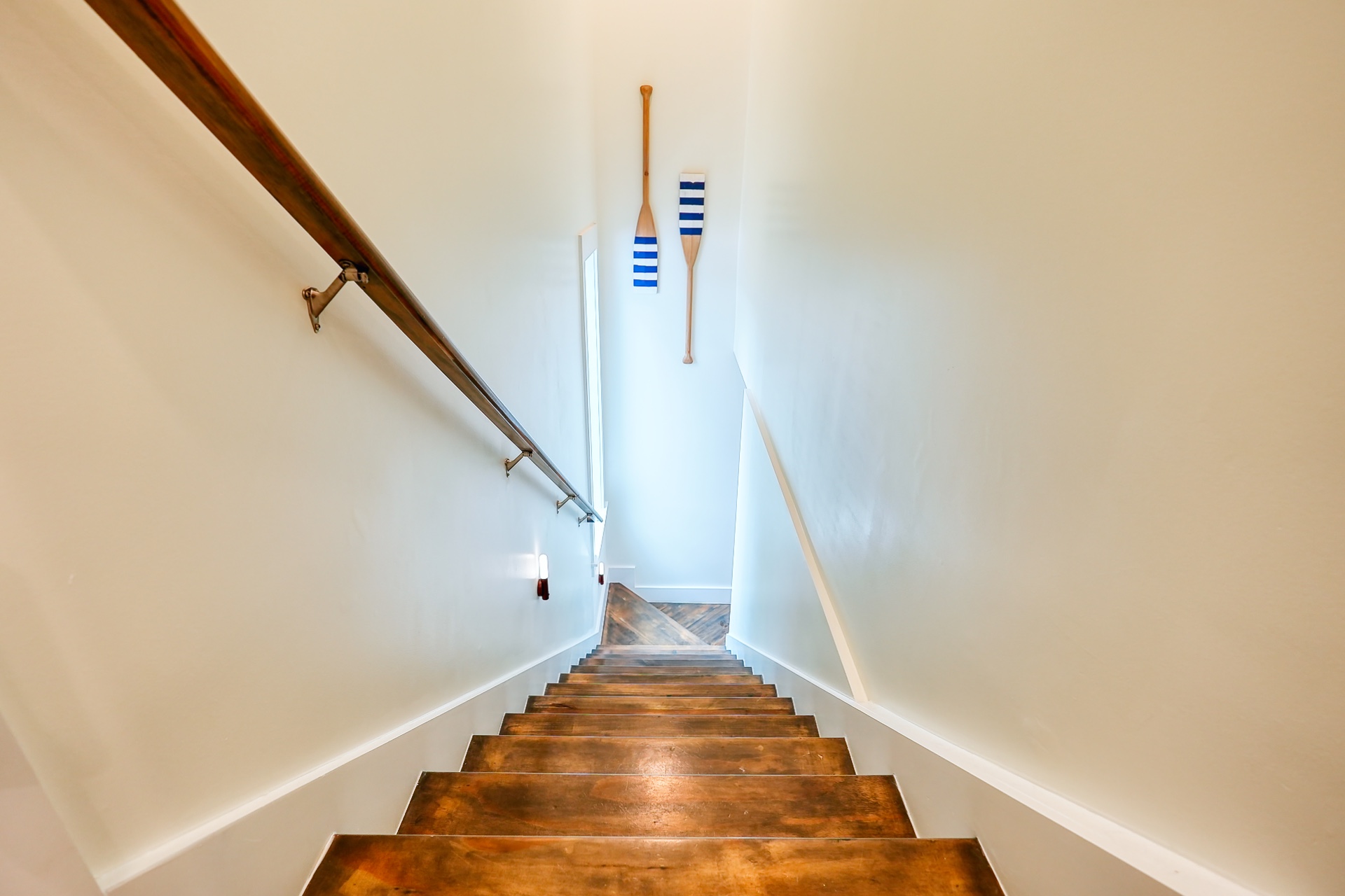 Professionally staged coastal interior staircase ready for a property shoot